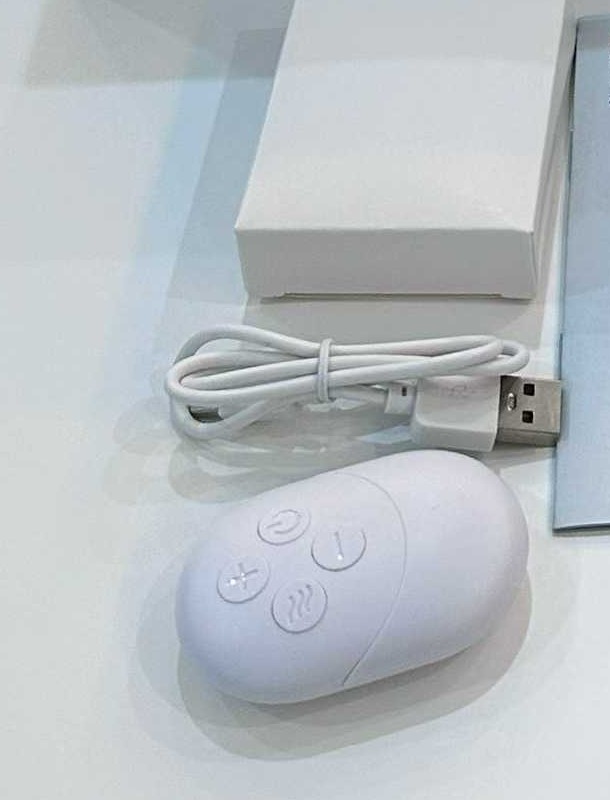 Cable and remote pictured beside one supplied F50 neck massager sample kit