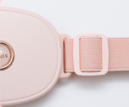 Pink adjustable strap attached to the Meilan N1 warming belt